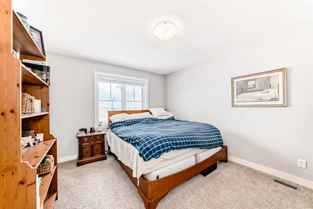 20893 Main Street Se, Calgary, AB - Indoor Photo Showing Bedroom