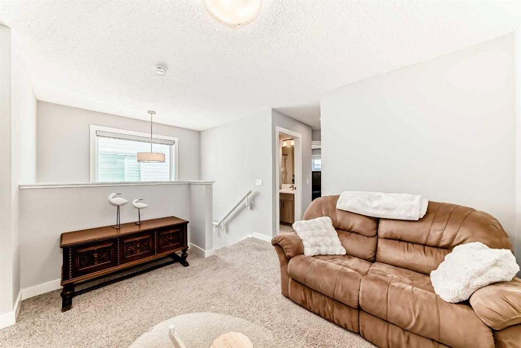 20893 Main Street Se, Calgary, AB - Indoor Photo Showing Living Room
