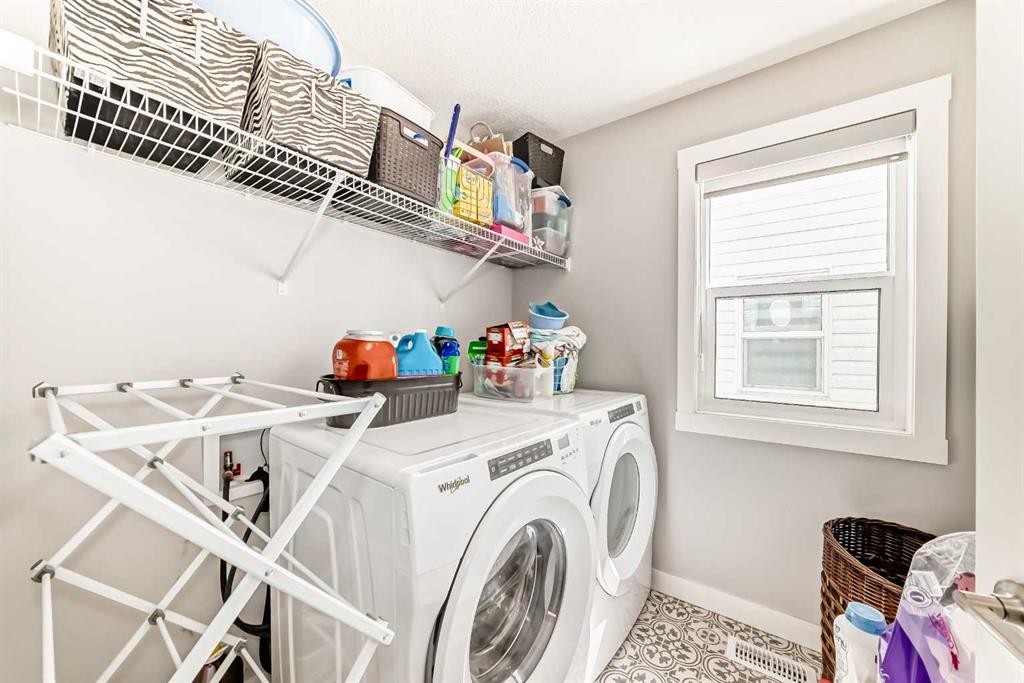 20893 Main Street Se, Calgary, AB - Indoor Photo Showing Laundry Room