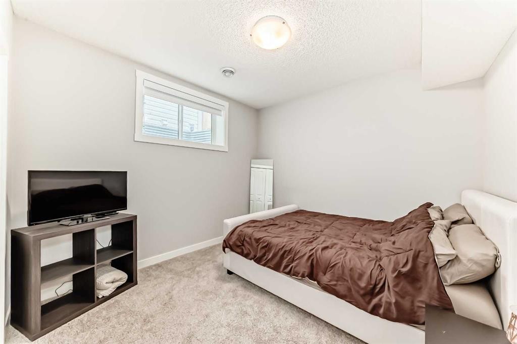 20893 Main Street Se, Calgary, AB - Indoor Photo Showing Bedroom
