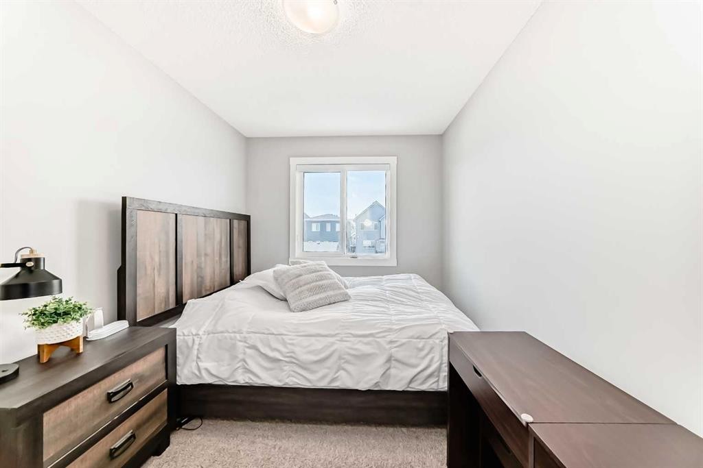 20893 Main Street Se, Calgary, AB - Indoor Photo Showing Bedroom