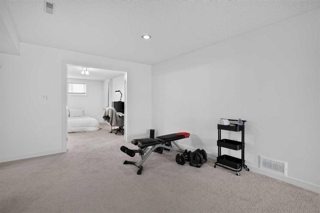 113 Mt Lorette Place Se, Calgary, AB - Indoor Photo Showing Gym Room