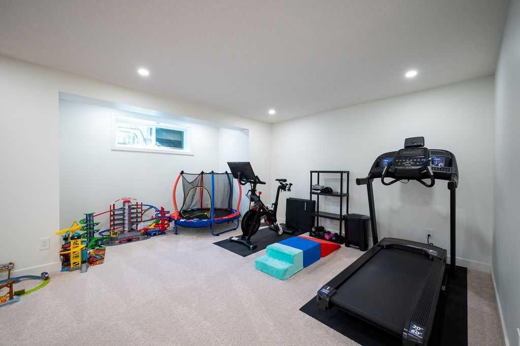 21 Chaparral Valley Court Se, Calgary, AB - Indoor Photo Showing Gym Room