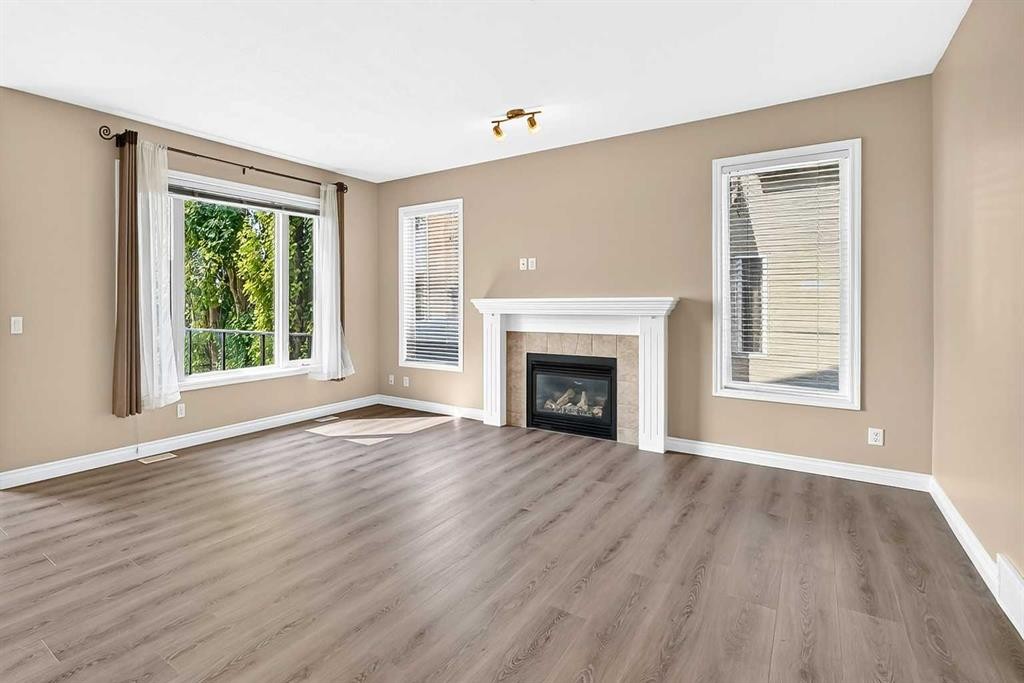 63 Royal Birch Point Nw, Calgary, AB - Indoor Photo Showing Living Room With Fireplace