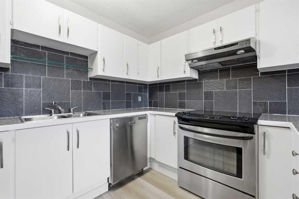 7003 Ranchero Road Nw, Calgary, AB - Indoor Photo Showing Kitchen With Stainless Steel Kitchen