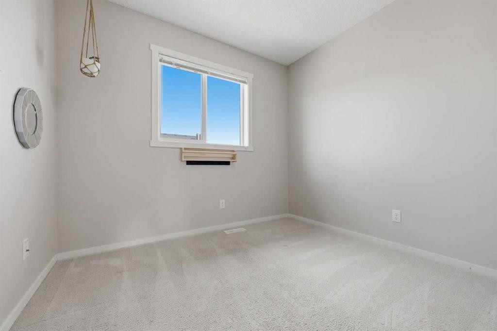 93 Sunvalley Road, Cochrane, AB - Indoor Photo Showing Other Room
