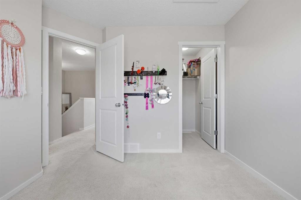 93 Sunvalley Road, Cochrane, AB - Indoor Photo Showing Other Room