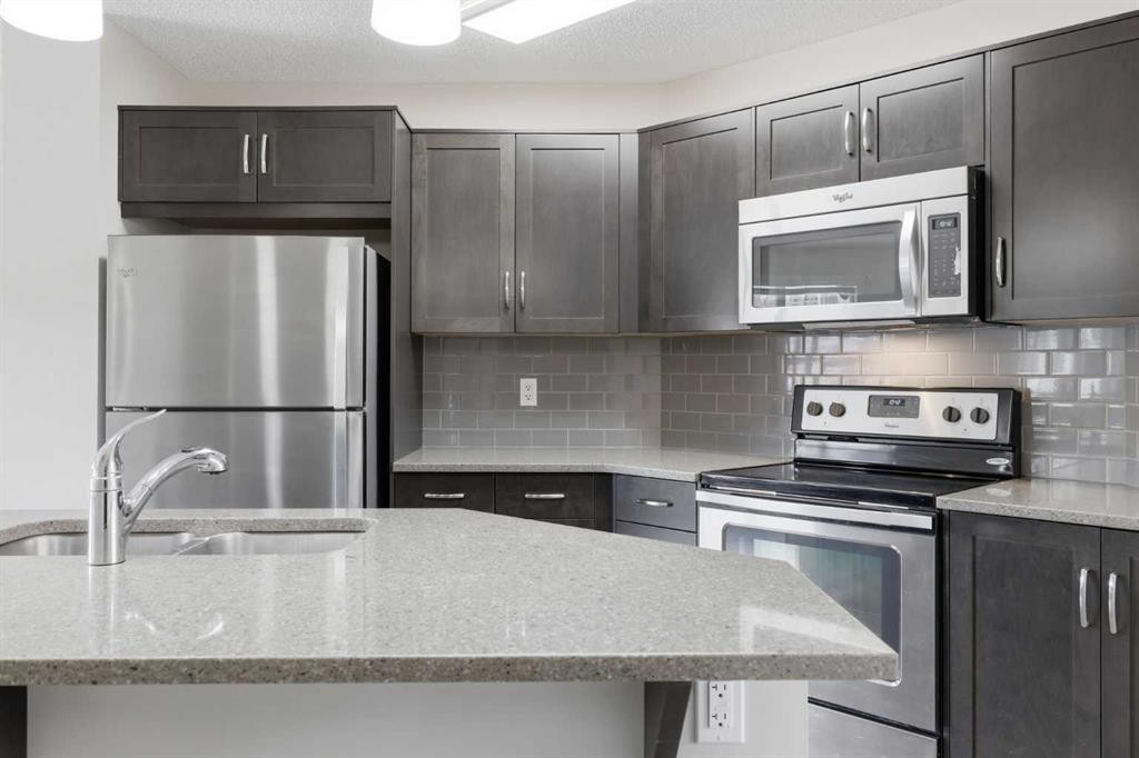 93 Sunvalley Road, Cochrane, AB - Indoor Photo Showing Kitchen With Double Sink With Upgraded Kitchen