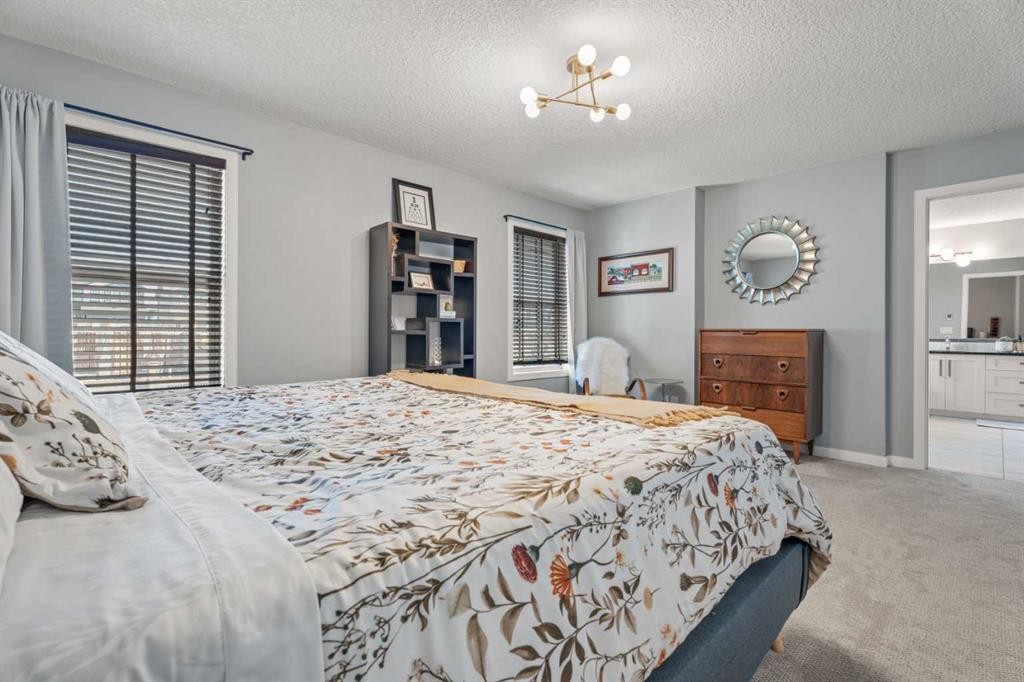 6 Storm Mountain Place, Okotoks, AB - Indoor Photo Showing Bedroom