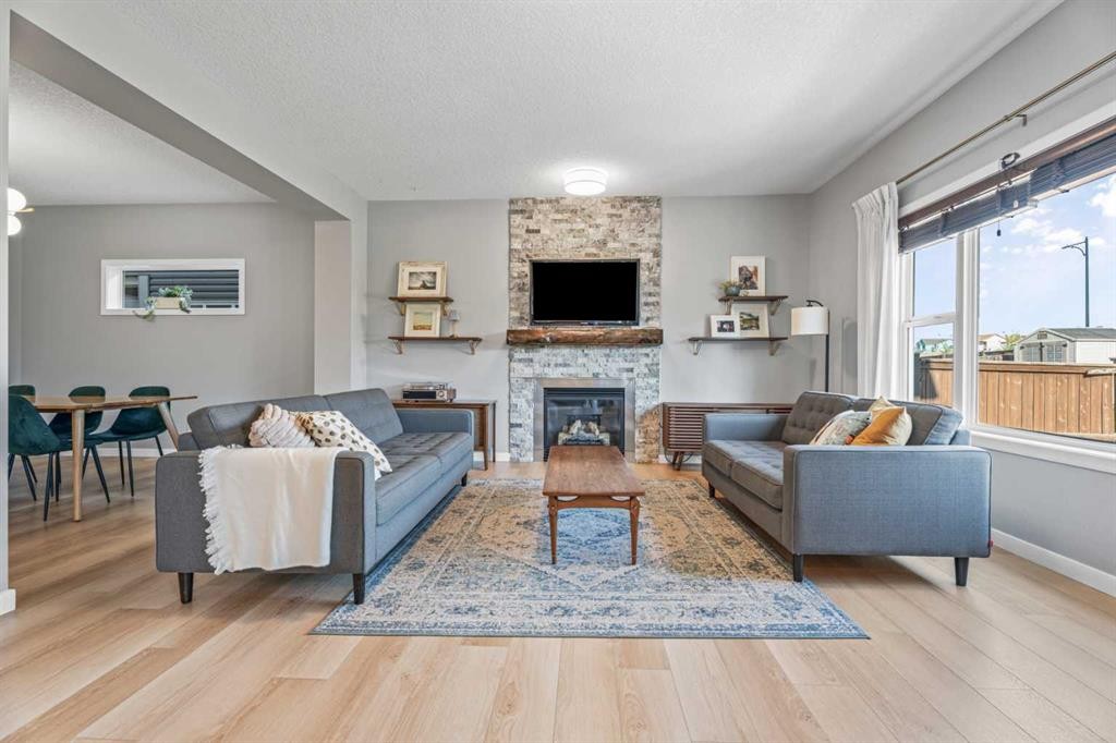 6 Storm Mountain Place, Okotoks, AB - Indoor Photo Showing Living Room With Fireplace