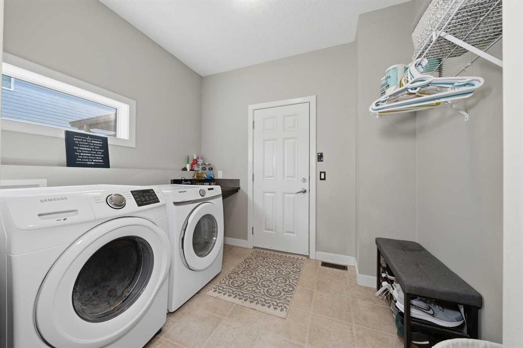 4 Drake Landing Gate, Okotoks, AB - Indoor Photo Showing Laundry Room