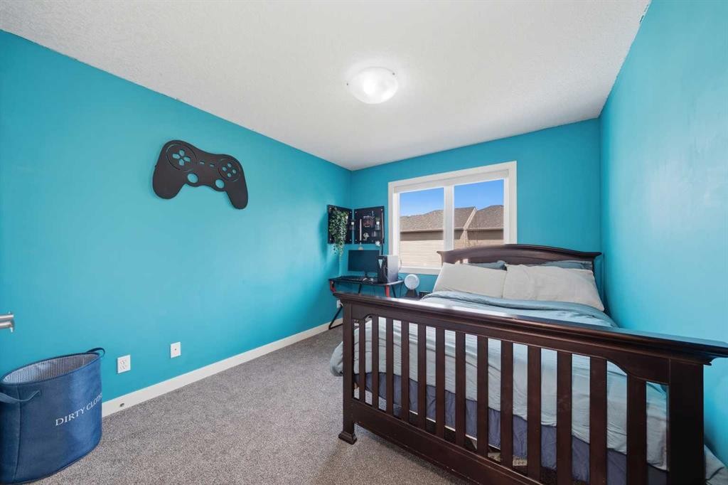 4 Drake Landing Gate, Okotoks, AB - Indoor Photo Showing Bedroom
