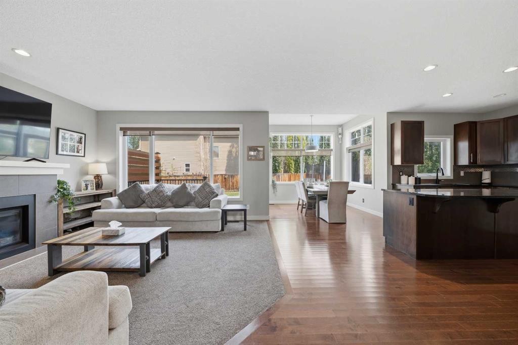 4 Drake Landing Gate, Okotoks, AB - Indoor Photo Showing Living Room With Fireplace