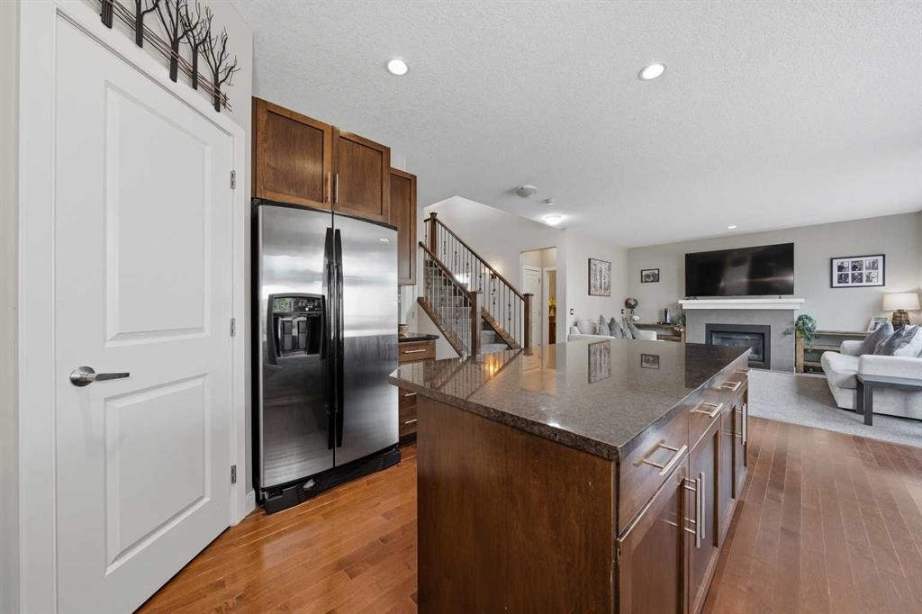 4 Drake Landing Gate, Okotoks, AB - Indoor With Fireplace