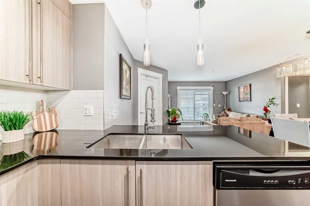 3313-11 Mahogany Row Se, Calgary, AB - Indoor Photo Showing Kitchen With Double Sink