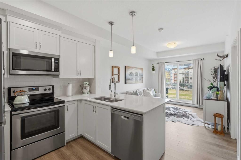 413-20 Seton Park Se, Calgary, AB - Indoor Photo Showing Kitchen With Double Sink With Upgraded Kitchen