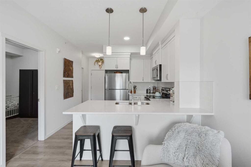 413-20 Seton Park Se, Calgary, AB - Indoor Photo Showing Kitchen With Double Sink With Upgraded Kitchen