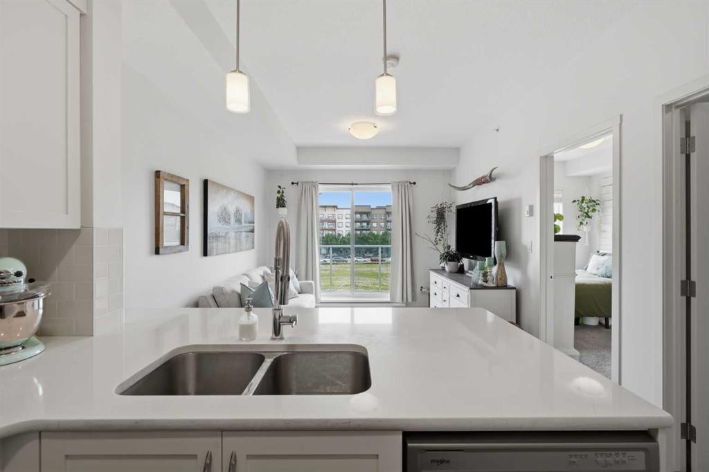 413-20 Seton Park Se, Calgary, AB - Indoor Photo Showing Kitchen With Double Sink