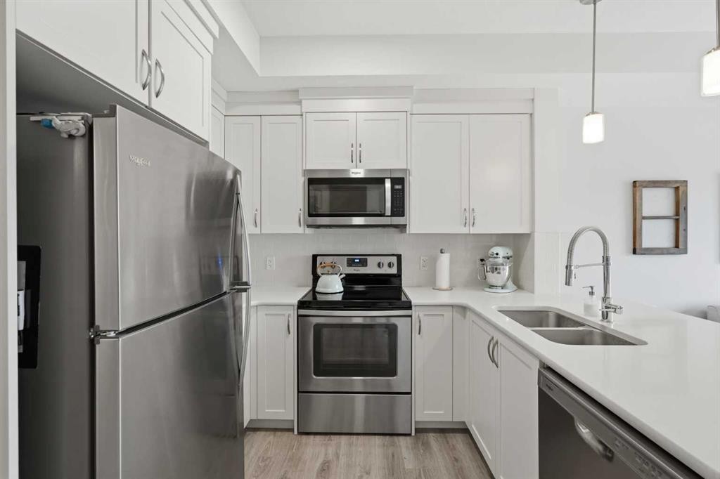 413-20 Seton Park Se, Calgary, AB - Indoor Photo Showing Kitchen With Double Sink With Upgraded Kitchen