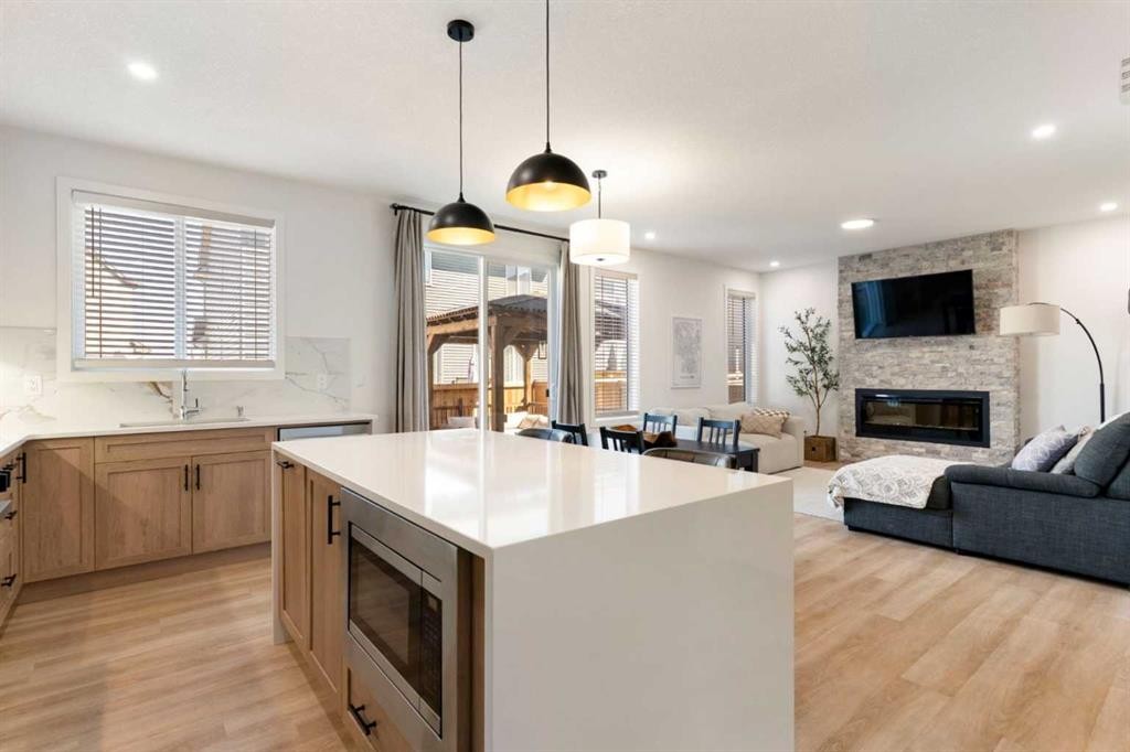 18 Southwinds Link Sw, Airdrie, AB - Indoor Photo Showing Other Room With Fireplace