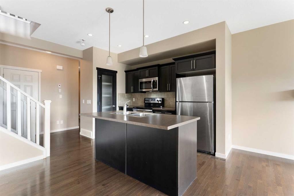 638 River Heights Crescent, Cochrane, AB - Indoor Photo Showing Kitchen With Double Sink With Upgraded Kitchen