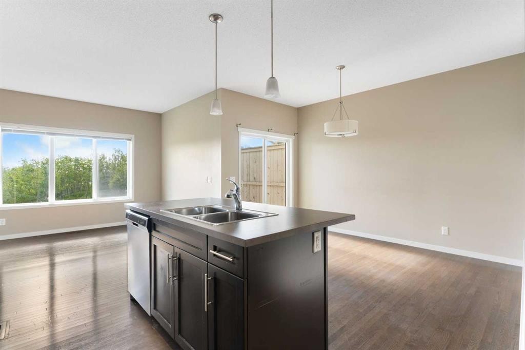 638 River Heights Crescent, Cochrane, AB - Indoor Photo Showing Kitchen With Double Sink