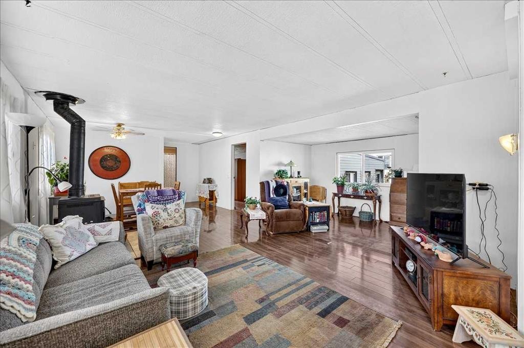 88 Big Hill Way Se, Airdrie, AB - Indoor Photo Showing Living Room With Fireplace