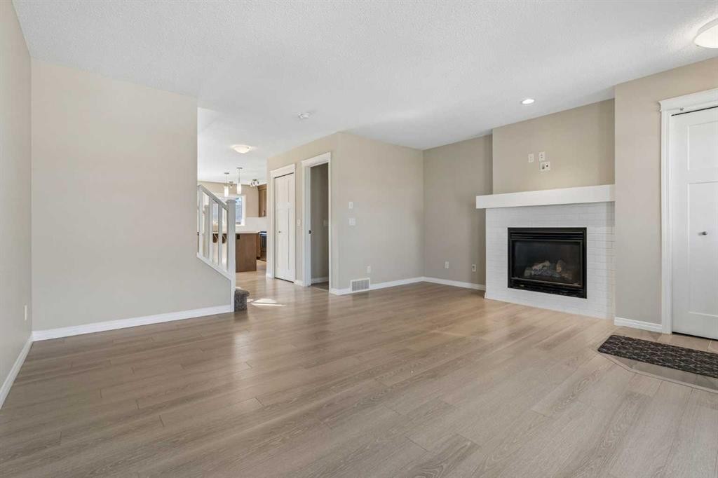 229 Fireside Drive, Cochrane, AB - Indoor Photo Showing Living Room With Fireplace