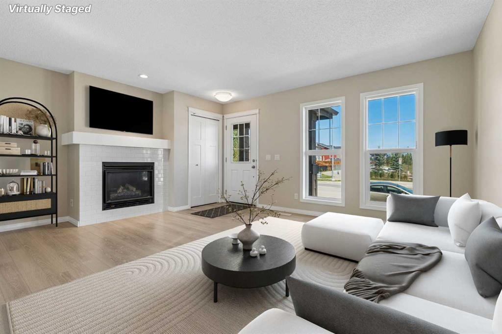 229 Fireside Drive, Cochrane, AB - Indoor Photo Showing Living Room With Fireplace