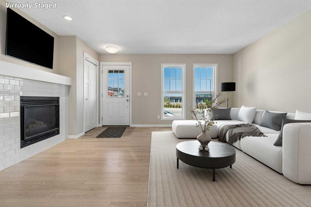 229 Fireside Drive, Cochrane, AB - Indoor Photo Showing Living Room With Fireplace