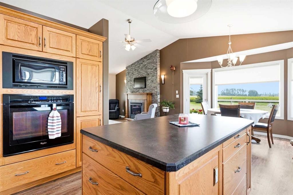 34055 Range Road 24, Rural Mountain View County, AB - Indoor Photo Showing Kitchen With Fireplace