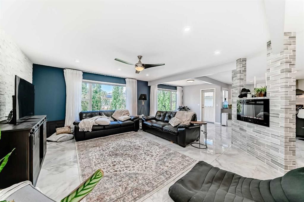 382 Cove Road, Chestermere, AB - Indoor Photo Showing Living Room With Fireplace