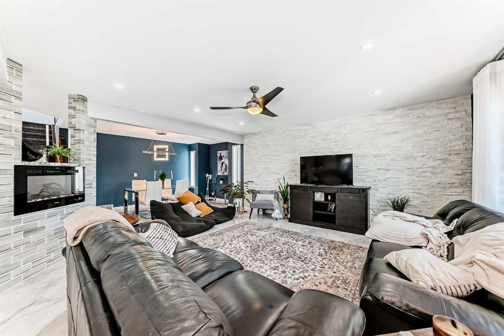 382 Cove Road, Chestermere, AB - Indoor Photo Showing Living Room With Fireplace