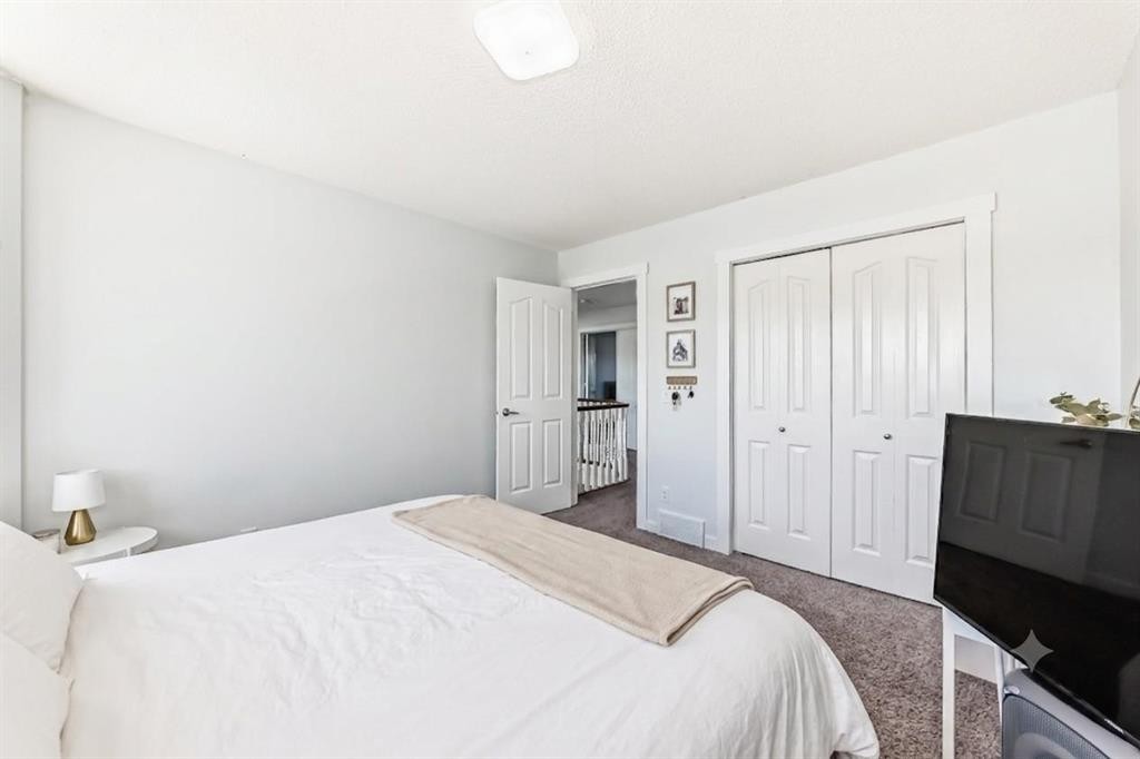 382 Cove Road, Chestermere, AB - Indoor Photo Showing Bedroom