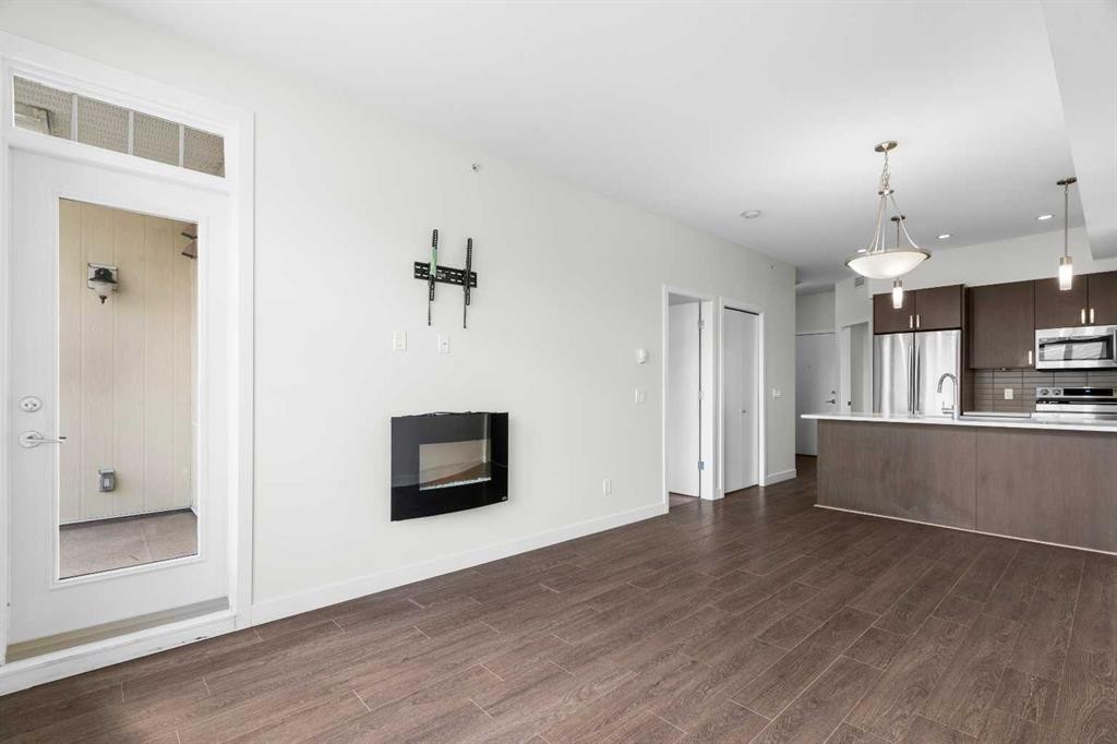411-28 Auburn Bay Link Se, Calgary, AB - Indoor With Fireplace