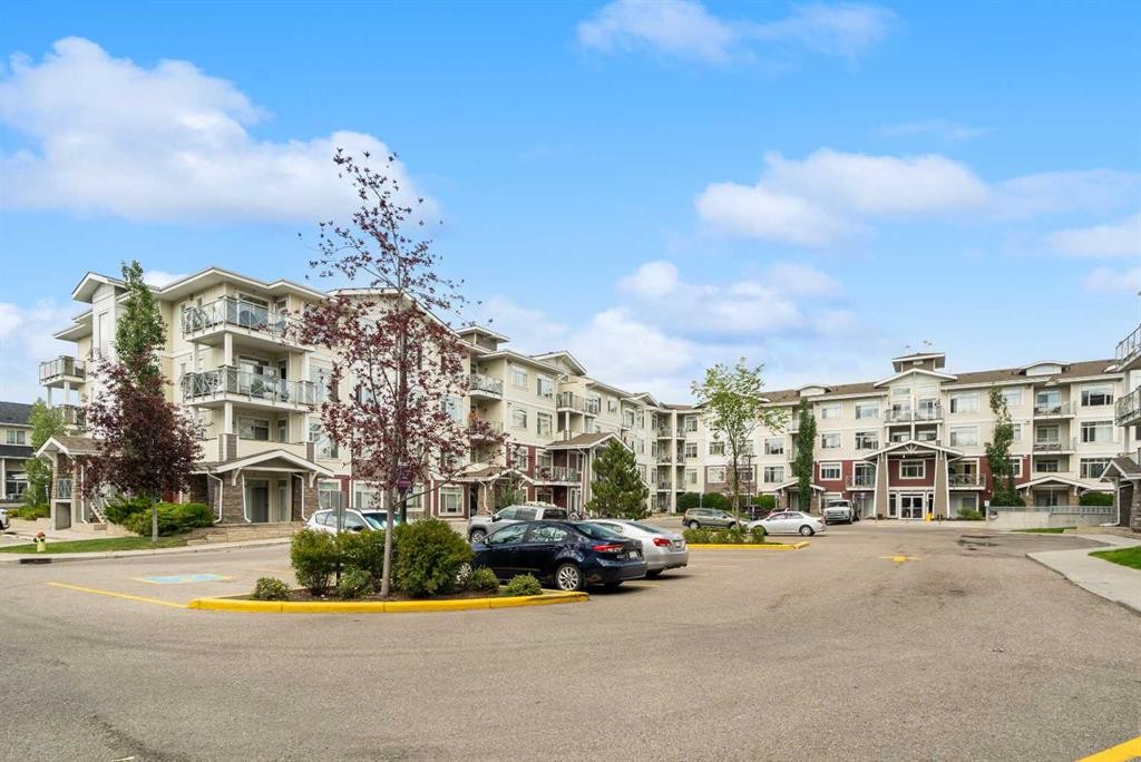 411-28 Auburn Bay Link Se, Calgary, AB - Outdoor With Balcony With Facade