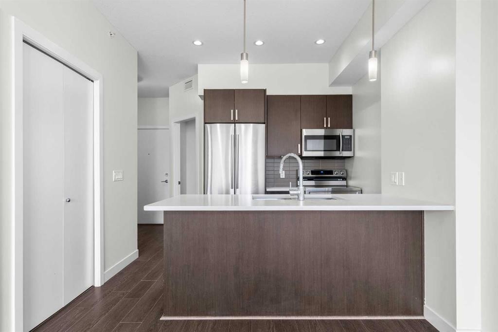 411-28 Auburn Bay Link Se, Calgary, AB - Indoor Photo Showing Kitchen With Stainless Steel Kitchen With Upgraded Kitchen