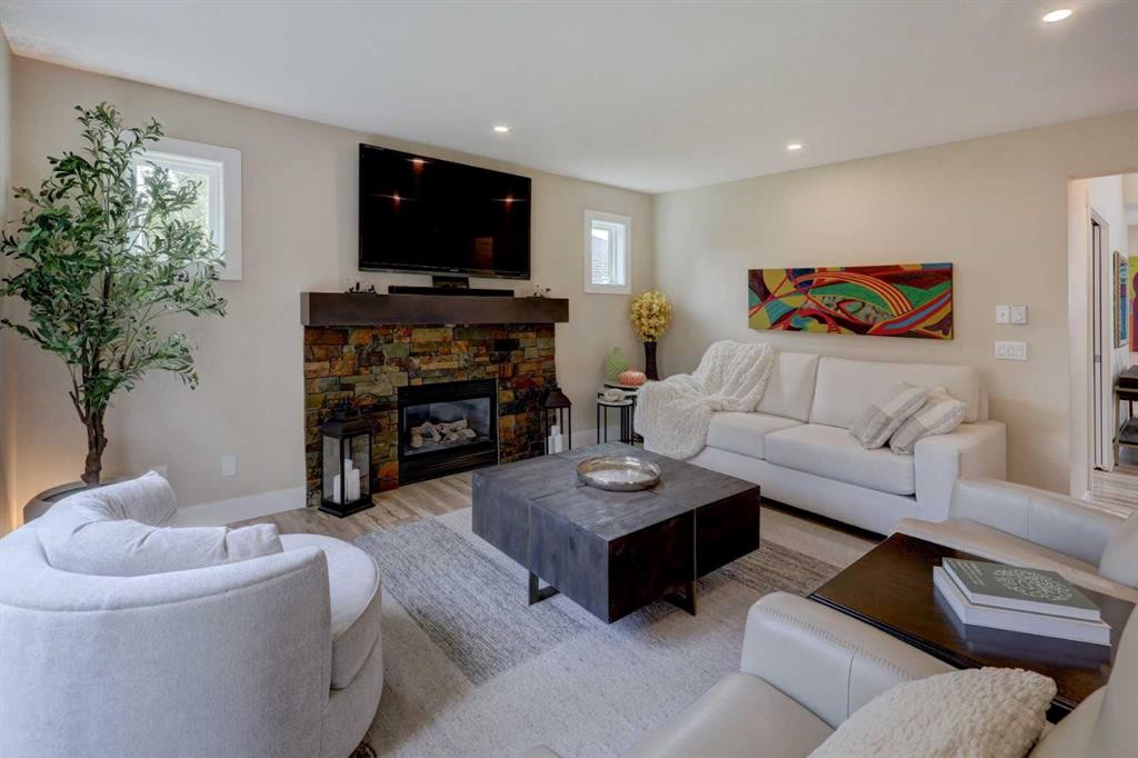 8 Canoe Road Sw, Airdrie, AB - Indoor Photo Showing Living Room With Fireplace