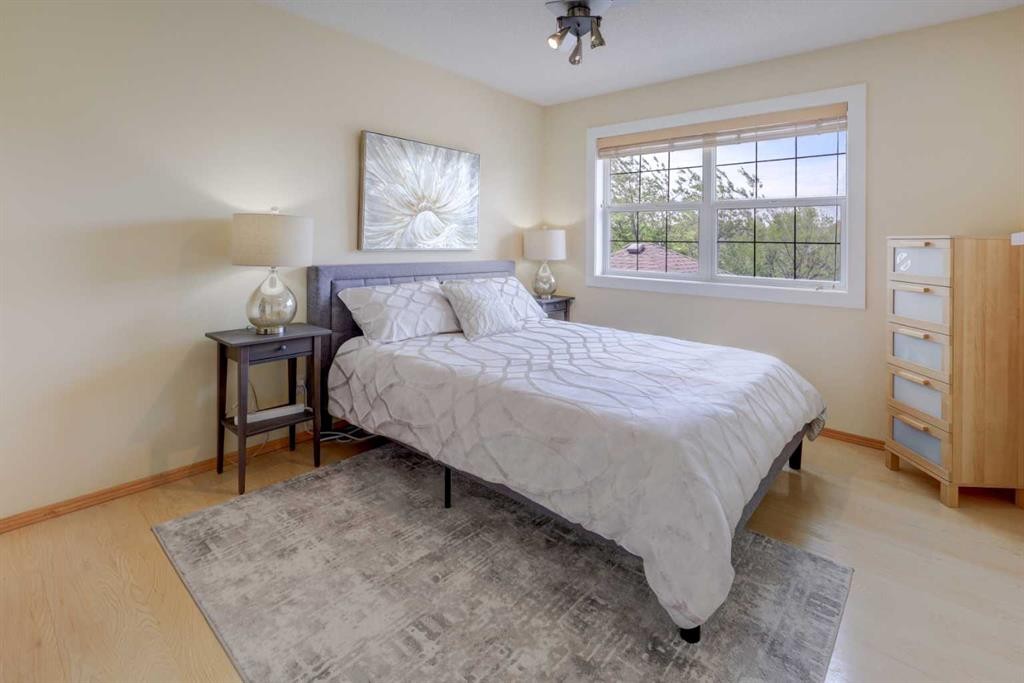 8 Canoe Road Sw, Airdrie, AB - Indoor Photo Showing Bedroom