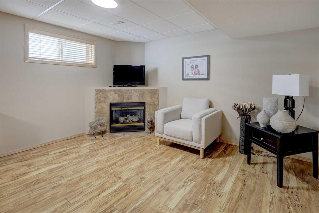 8 Canoe Road Sw, Airdrie, AB - Indoor With Fireplace