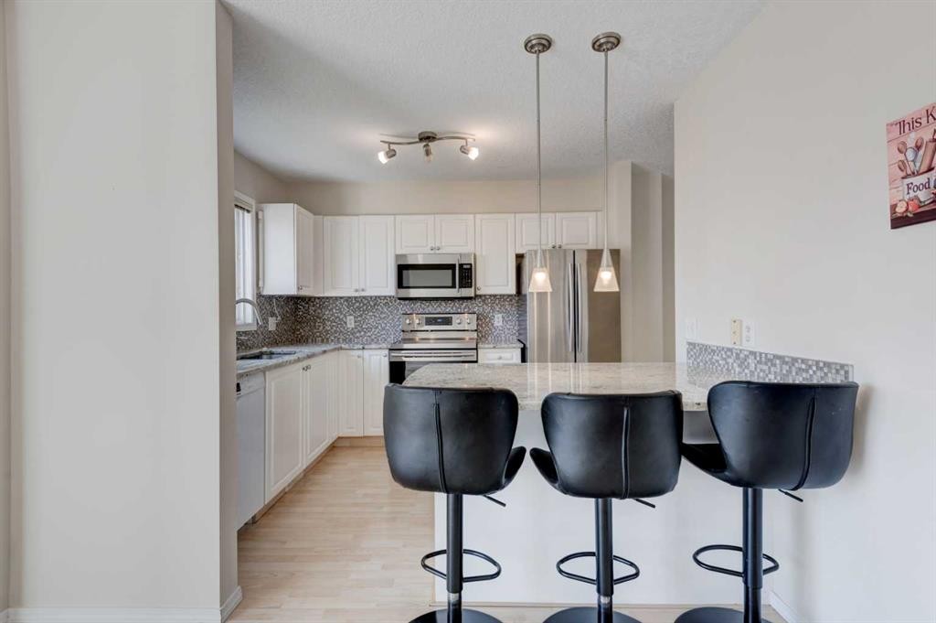 34 Eversyde Common Sw, Calgary, AB - Indoor Photo Showing Kitchen With Stainless Steel Kitchen With Upgraded Kitchen