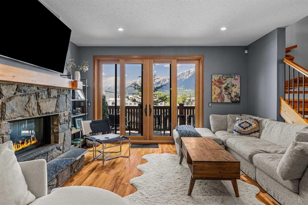 8-511 6Th Avenue, Canmore, AB - Indoor Photo Showing Living Room With Fireplace