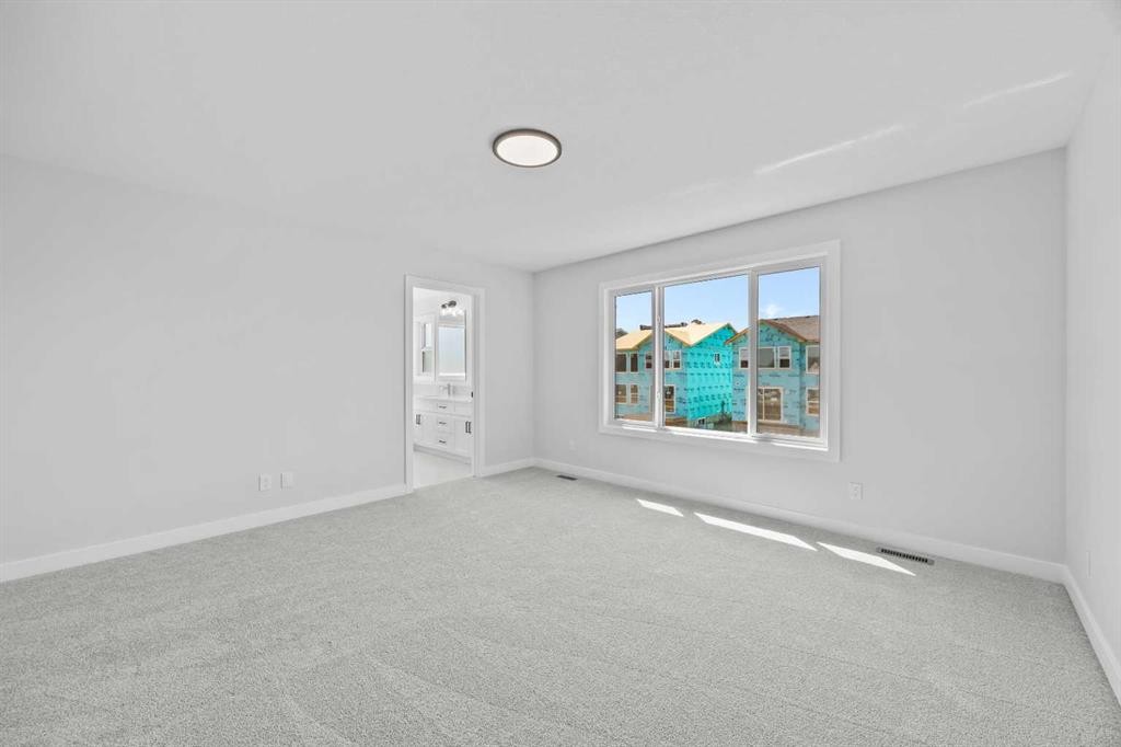 35 Creekside Rise Sw, Calgary, AB - Indoor Photo Showing Other Room