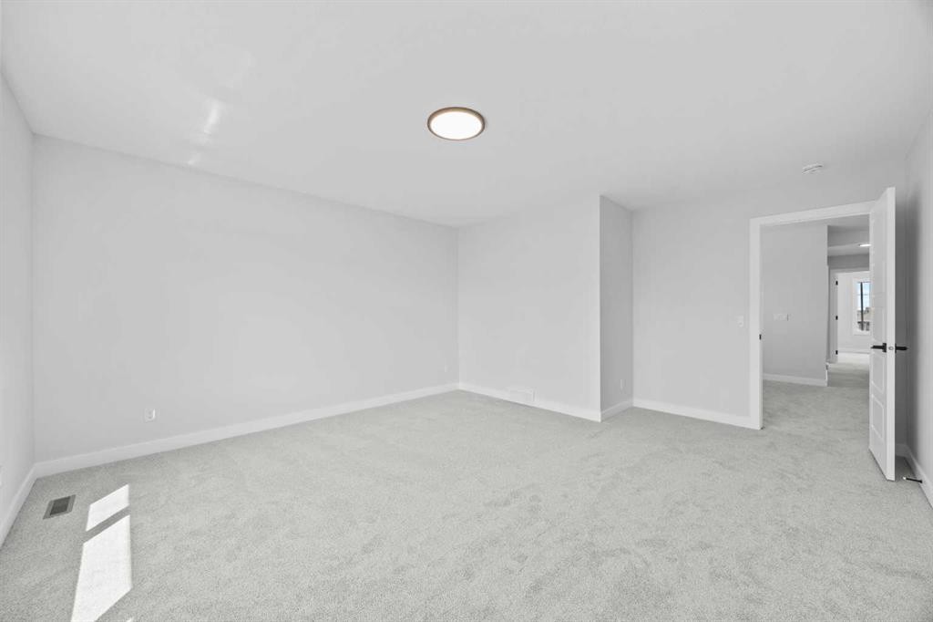 35 Creekside Rise Sw, Calgary, AB - Indoor Photo Showing Other Room