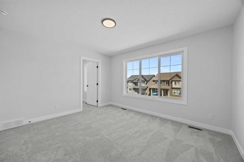 35 Creekside Rise Sw, Calgary, AB - Indoor Photo Showing Other Room