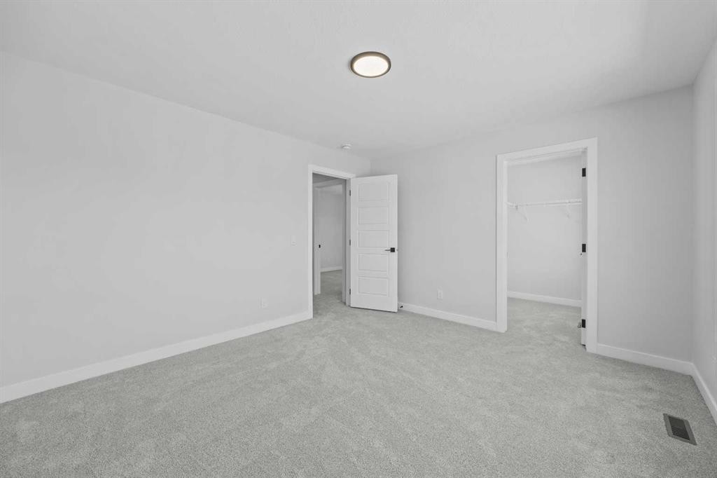 35 Creekside Rise Sw, Calgary, AB - Indoor Photo Showing Other Room