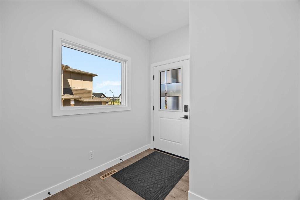 35 Creekside Rise Sw, Calgary, AB - Indoor Photo Showing Other Room
