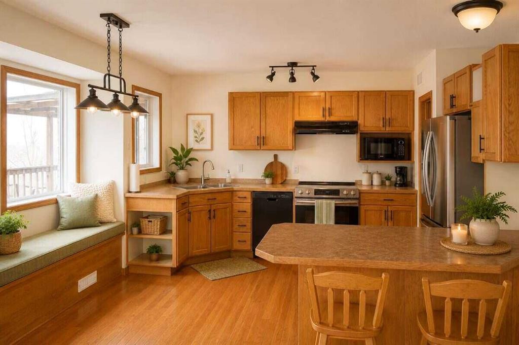 145-37411 Waskasoo Avenue, Rural Red Deer County, AB - Indoor Photo Showing Kitchen With Double Sink