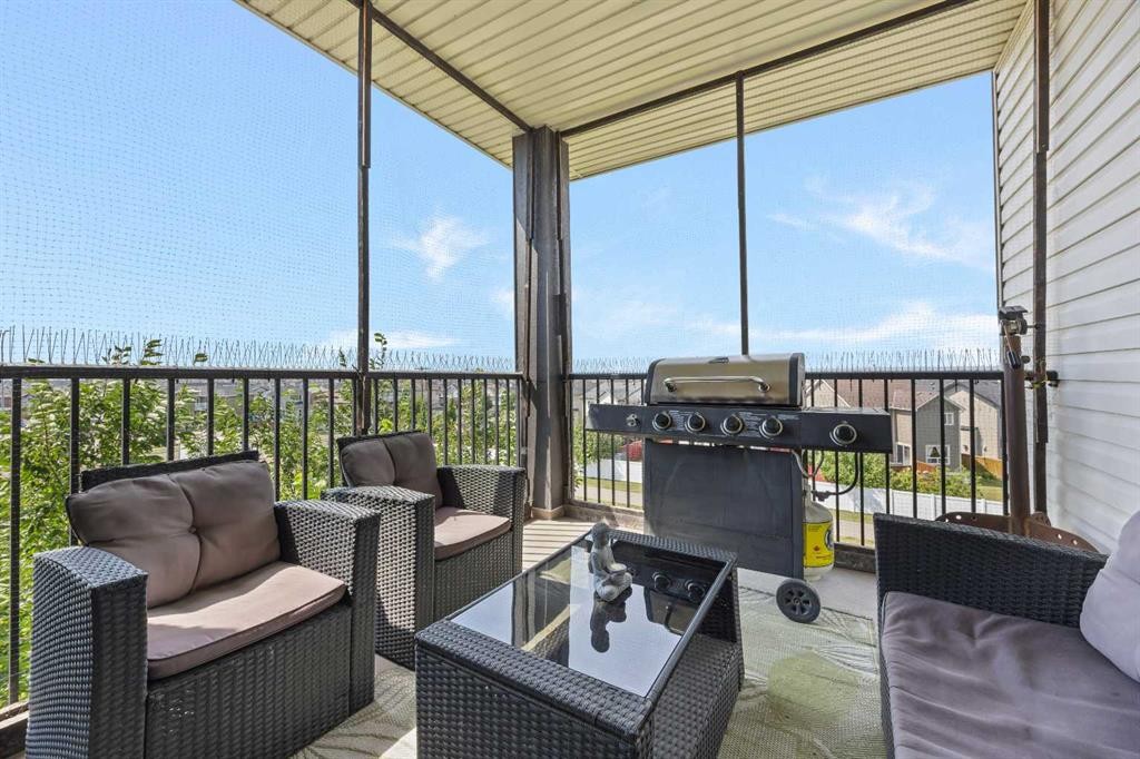 401-7110 80 Avenue Ne, Calgary, AB - Outdoor With Deck Patio Veranda With Exterior
