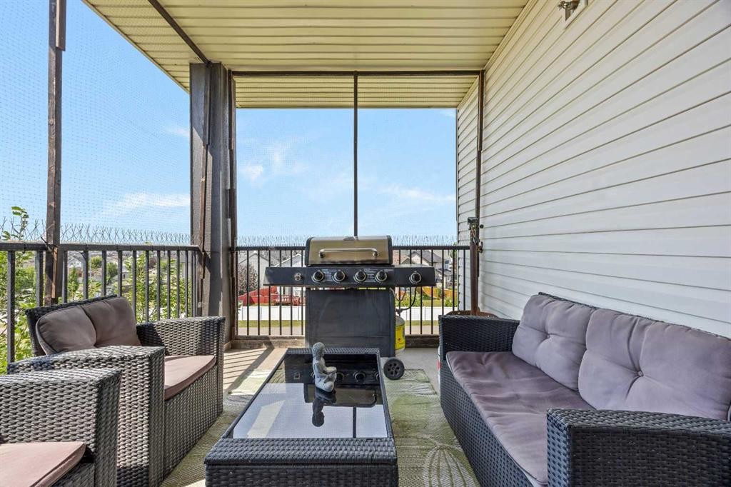 401-7110 80 Avenue Ne, Calgary, AB - Outdoor With Deck Patio Veranda With Exterior
